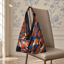 Borsa Camouflage blu e arancio con pochette coordinata